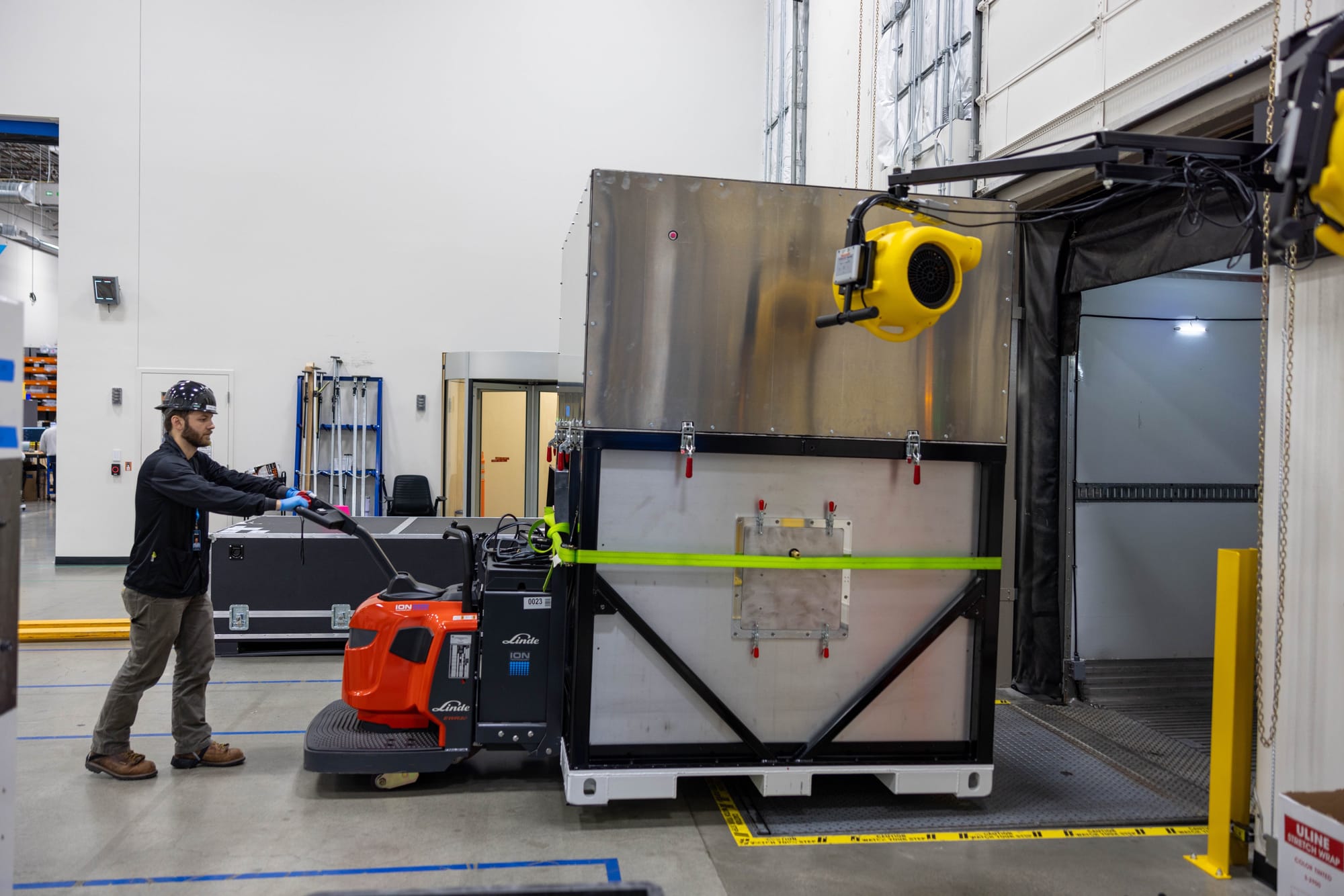 A create containing Kuiper satellites being loaded onto a truck. ©Amazon