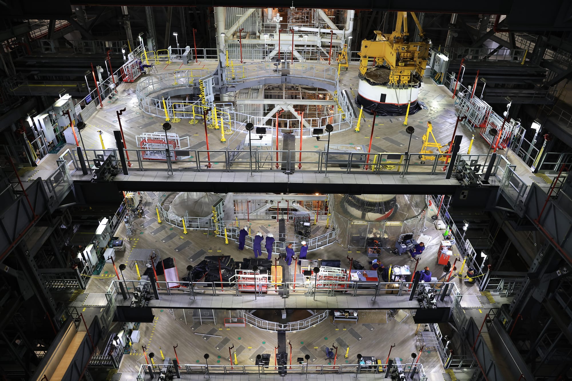 NASA teams stacking SLS' solid rocket boosters inside the Kennedy Space Center's Vehicle Assembly Building. ©Kim Shiflett/NASA