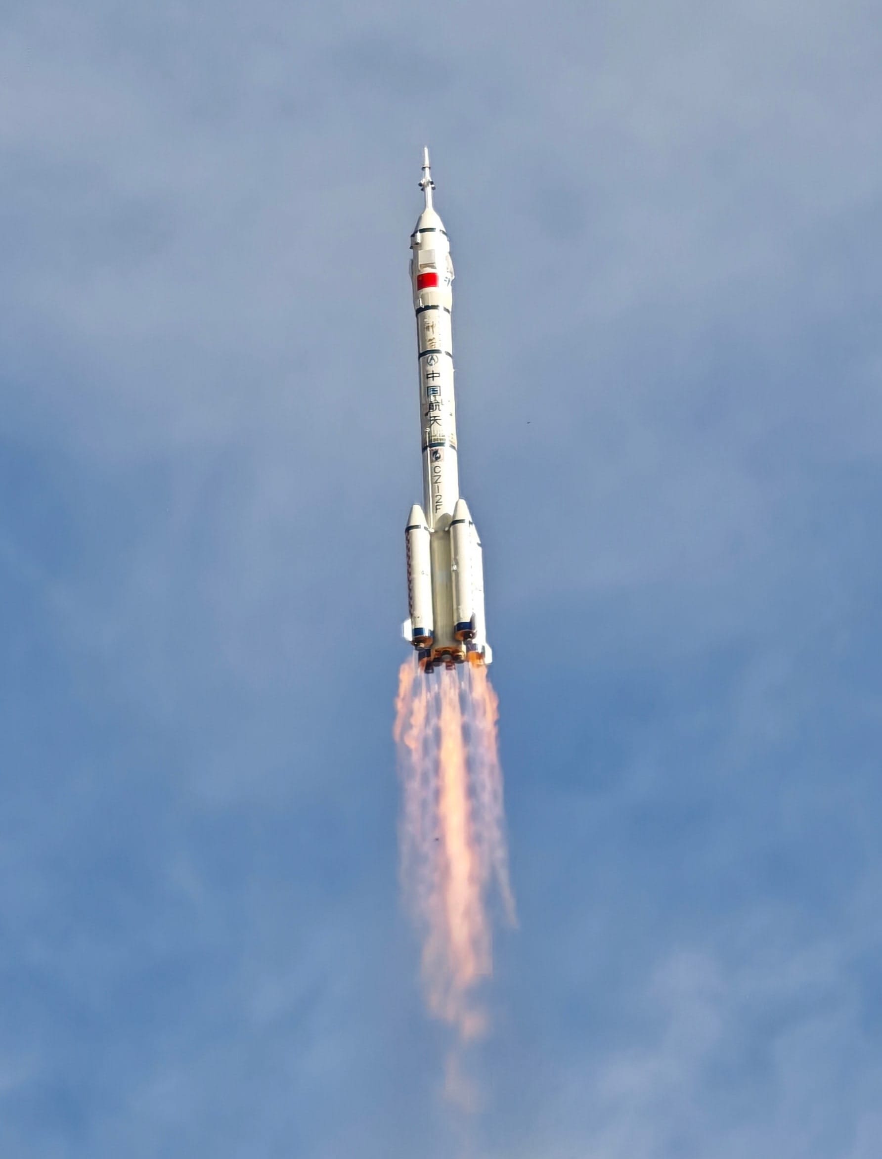 The Long March 2F/G launch vehicle during first-stage flight for the Shenzhou-20 mission.