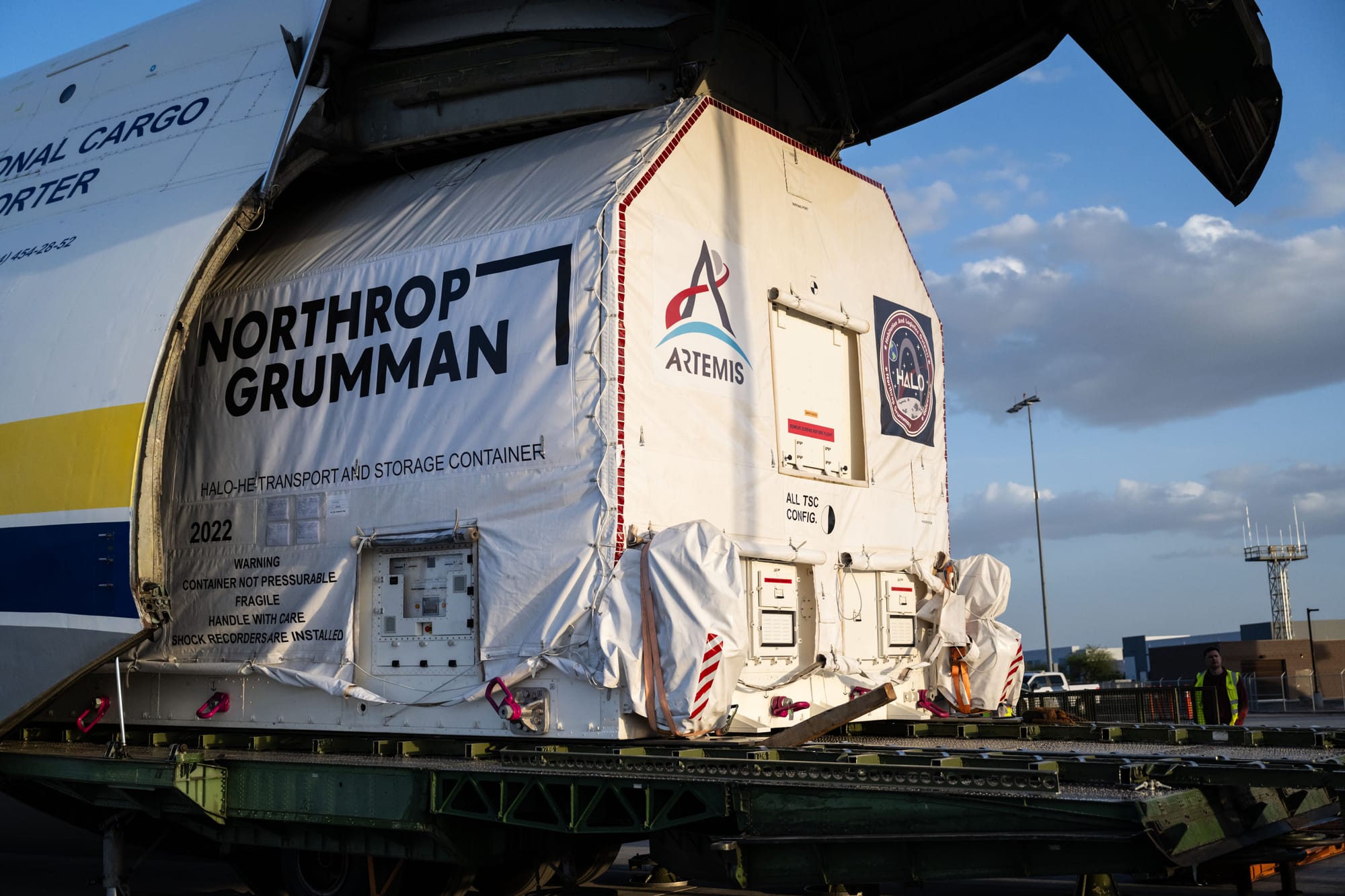 The HALO module in its transport container being unloaded after its flight from Italy to Arizona. ©Josh Valcarcel/NASA