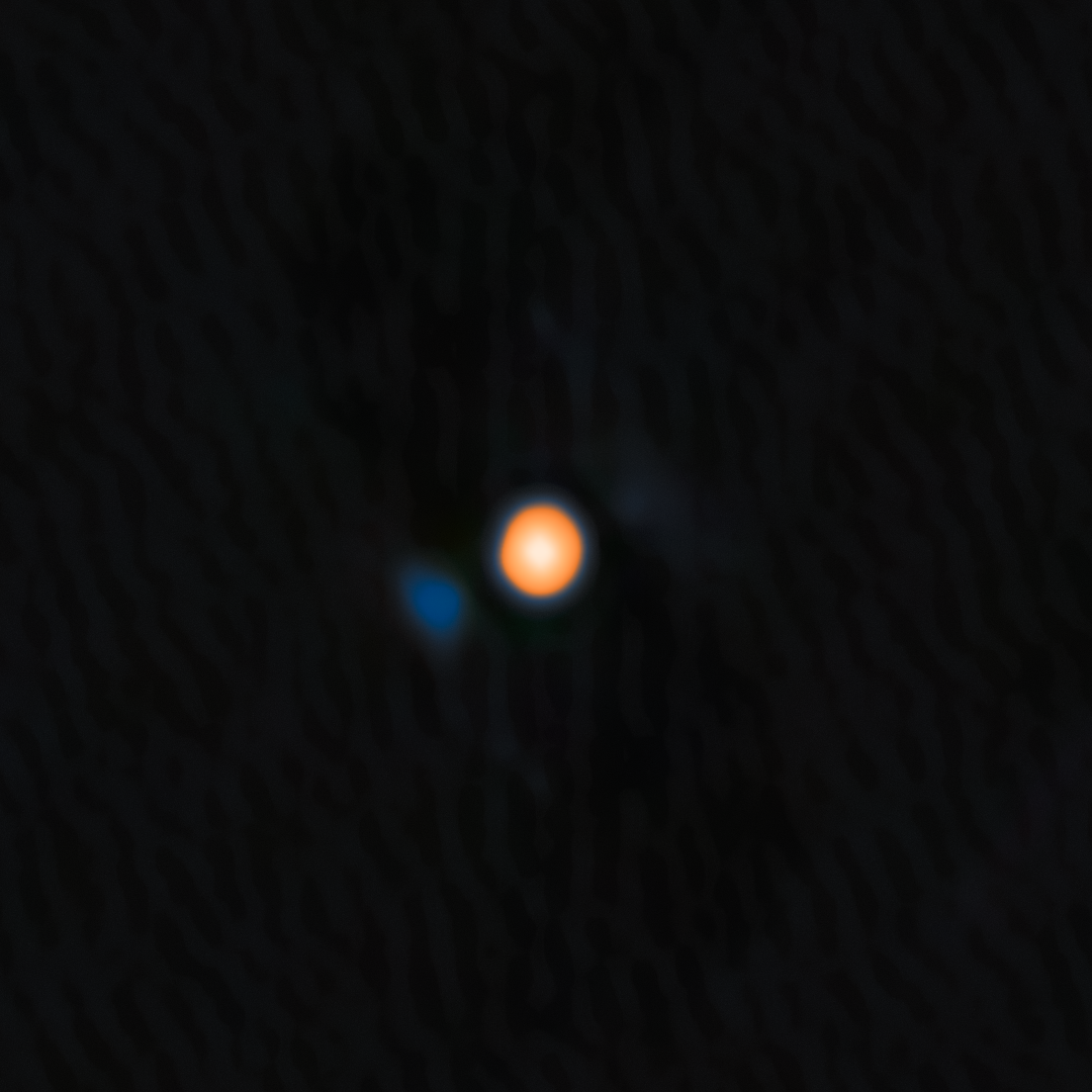 An image of Betelgeuse, the yellow-red star, and the signature of its close companion, the faint blue object. ©National Optical-Infrared Astronomy Research Laboratory/NASA/Jet Propulsion Laboratory