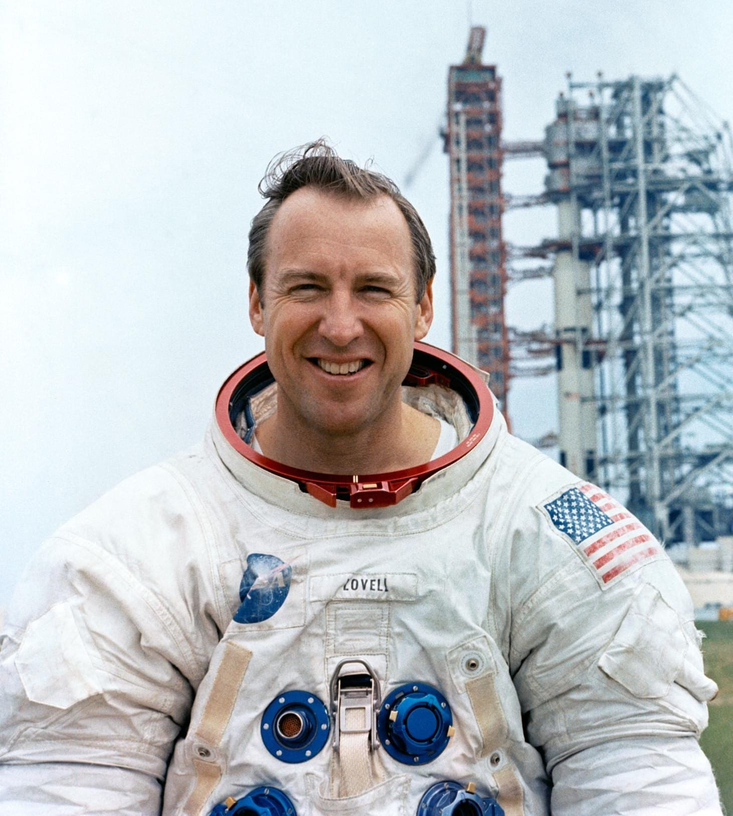 Jim Lovell pictured before the Apollo 13 mission in front of the mission's Saturn V rocket. ©NASA