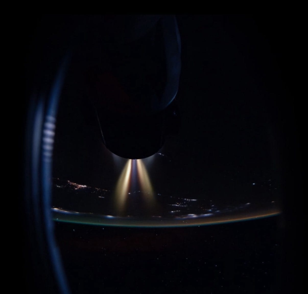 The CRS-33 Cargo Dragon seen from the Crew-11's Crew Dragon performing an orbit boosting demonstration while docked to the International Space Station. ©NASA