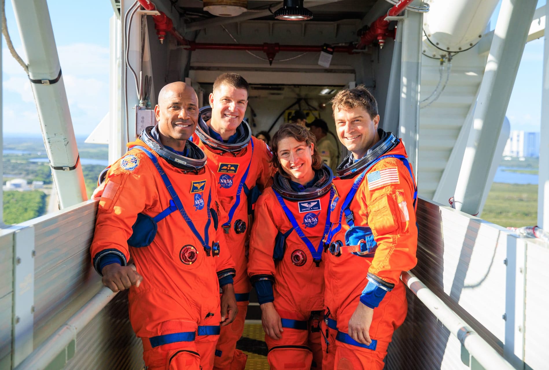 Victor Glover (left), Jeremy Hansen (center left), Christina Koch (center right), and Reid Wiseman (right) stood on the crew access arm of SLS' mobile launcher in September 2023. ©Frank Michaux/NASA