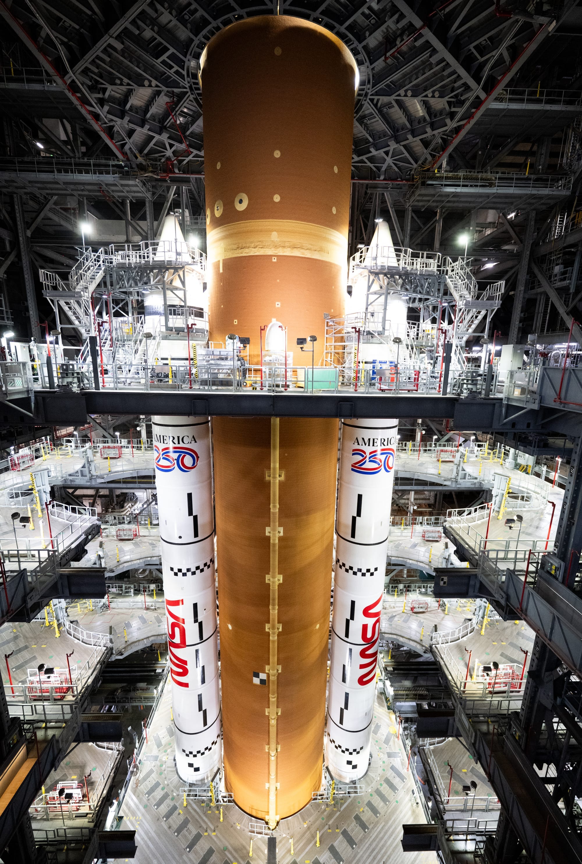 The SLS rocket for the Artemis II mission inside High Bay 3 of the Vehicle Assembly Building with a handful of access platforms retracted on December 20th 2025. ©Joel Kowsky/NASA