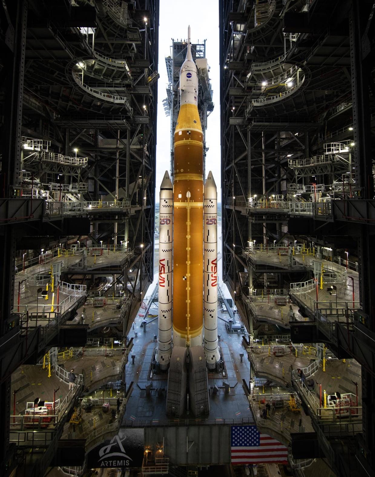 The Space Launch System rocket for the Artemis II mission rolling out from the Kennedy Space Center's Vehicle Assembly Building in January 2026 for pre-mission testing. ©Joel Kowsky/NASA